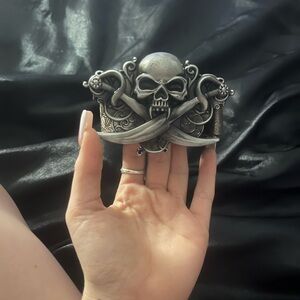 Y2k skull with sword pirate like design belt buckle, comes with brown belt.